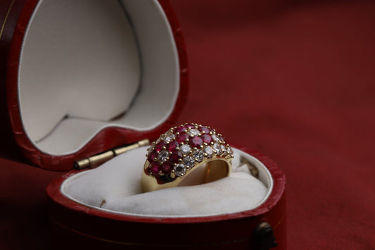 18ct Gold Diamond & Ruby Set Flower Patterned Wide Band Vintage Ring in a red heart shaped jewellery box