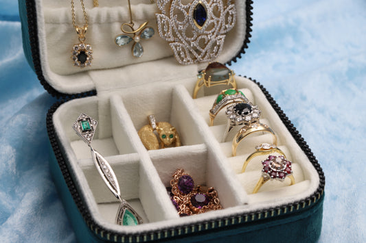 Jewellery box filled with jewellery such as diamond set rings, pendants and necklaces