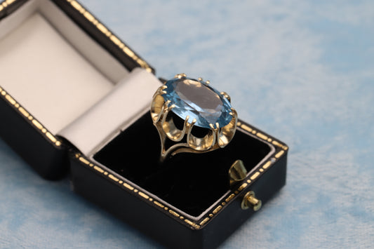 9ct Gold Blue Topaz Dress Ring in a black jewellery box