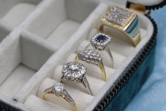 Selection of diamond set gold rings such as signet rings, cluster rings and solitaire rings