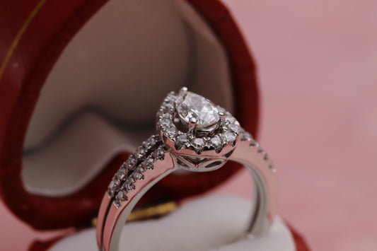 18ct White Gold Diamond Pear Cut Double Row Halo Ring in a red jewellery box