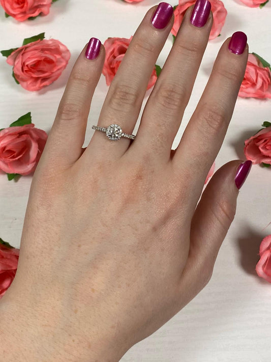 18ct White Gold & Diamond Halo Engagement Ring on a hand