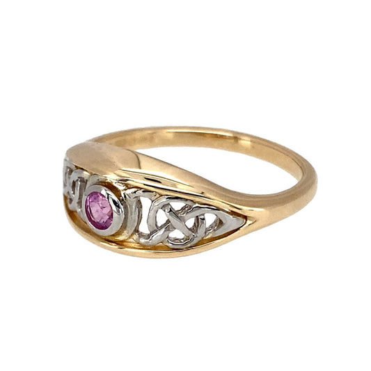 Preowned 9ct Yellow and White Gold & Pink Sapphire Set Clogau Celtic Knot Ring in size L with the weight 2.60 grams. The front of the ring is 8mm high and the pink sapphire stone is approximately 2.5m diameter