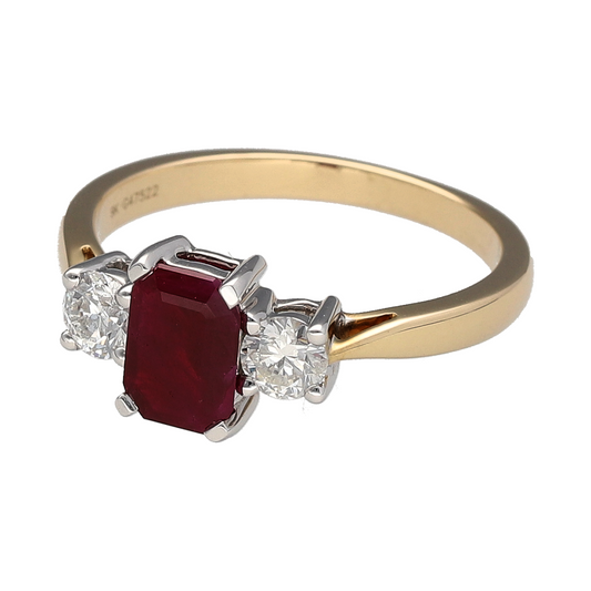 Bring timeless colour and classic sparkle to your jewellery collection with this new 9ct yellow gold diamond and ruby trilogy ring—a refined piece with elegant symmetry and rich gemstone contrast.
Design: Featuring a 7mm by 5mm emerald-cut ruby at the centre, flanked by two brilliant-cut diamonds totalling approximately 0.41ct, the trilogy design offers a bold yet balanced look.