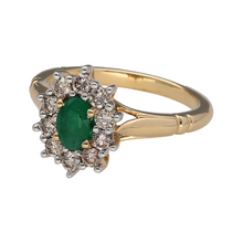 Load image into Gallery viewer, New 9ct Yellow and White Gold Diamond &amp; Emerald Set Cluster Ring in size M to N. The front of the ring is 13mm high and the emerald stone is approximately 6mm by 4mm. There is approximately 0.51ct of real natural diamonds set in the cluster in total. The diamonds are approximate clarity Si - i1 and colour K - M
