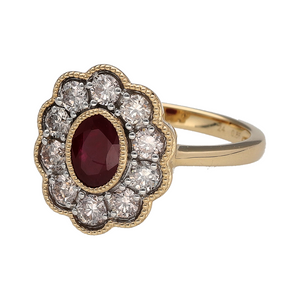 New 9ct Yellow and White Gold Diamond & Ruby Set Cluster Ring in size N with a beaded edge detail. The front of the ring is 16mm high and the ruby stone is approximately 6.5mm by 4.5mm. There is approximately 0.86ct of real natural diamonds set in the cluster in total