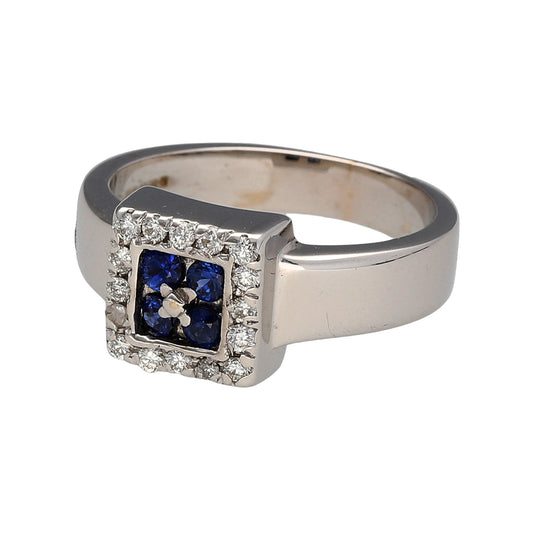 Preowned 18ct White Gold Diamond & Sapphire Set Halo Ring in size J with the weight 6.90 grams. The sapphire stones are each 2mm diameter and the front of the ring is 8mm high