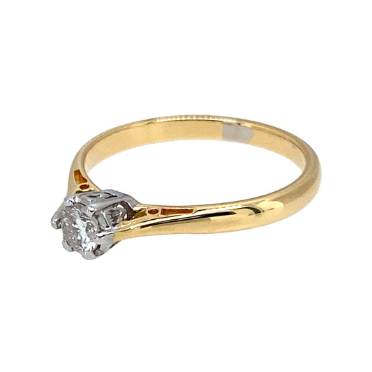Preowned 18ct Yellow and White Gold & Diamond Set Solitaire Ring in size L with the weight 2.30 grams. The diamond is approximately 15pt