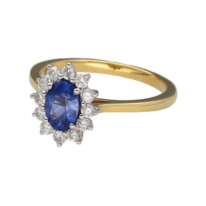 New 18ct Yellow and White Gold Diamond & Sapphire Cluster Ring in size N with the weight 3.20 grams. The sapphire stone is 7mm by 5mm and there is approximately 37pt of diamond content in total