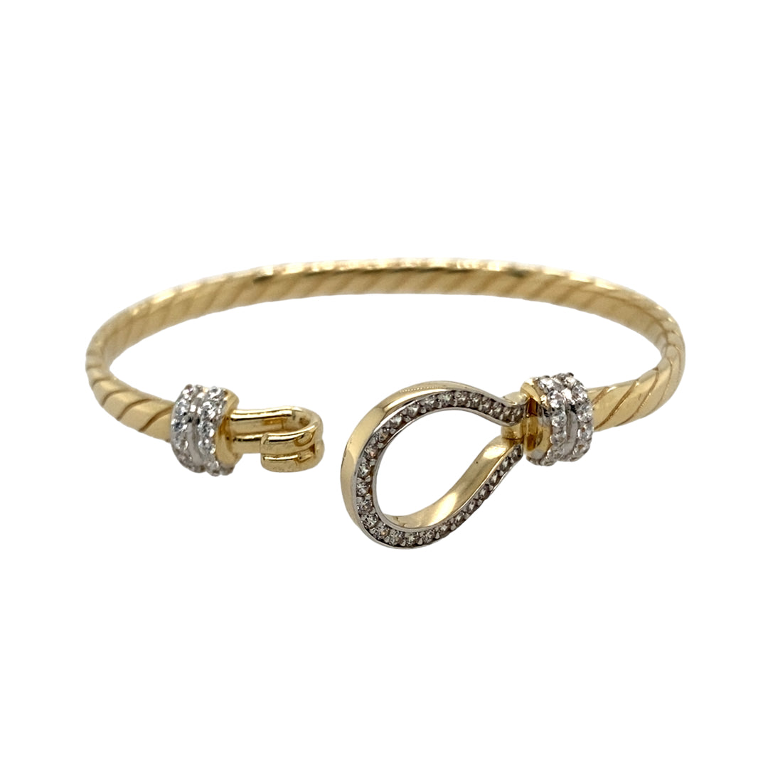 New 9ct Yellow and White Solid Gold & Cubic Zirconia Set Twisted Horseshoe Baby Bangle with the weight 10.50 grams. The front of the bangle is 13mm high and the main bangle band is 4mm. The bangle diameter is 5cm