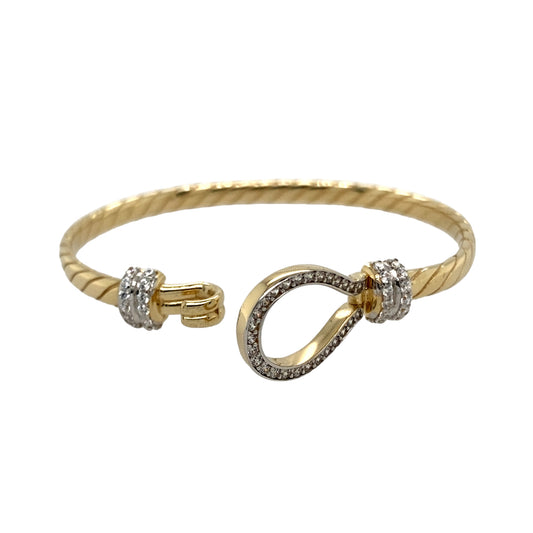 New 9ct Yellow and White Solid Gold & Cubic Zirconia Set Twisted Horseshoe Baby Bangle with the weight 10.50 grams. The front of the bangle is 13mm high and the main bangle band is 4mm. The bangle diameter is 5cm