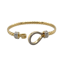 Load image into Gallery viewer, New 9ct Yellow and White Solid Gold &amp; Cubic Zirconia Set Twisted Horseshoe Baby Bangle with the weight 10.50 grams. The front of the bangle is 13mm high and the main bangle band is 4mm. The bangle diameter is 5cm

