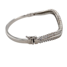 Load image into Gallery viewer, Preowned 9ct White Gold &amp; Cubic Zirconia Set Wave Hinged Bangle with the weight 12.80 grams. The bangle is 6.6cm diameter and the front of the bangle width is 6mm 
