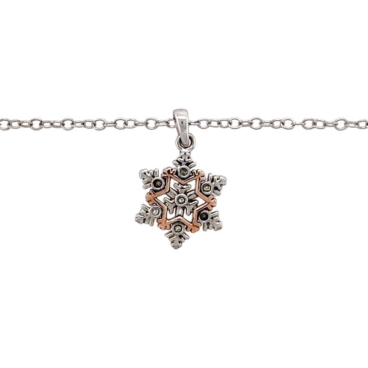 Preowned 925 Silver Clogau with 9ct Rose Gold & Cubic Zirconia Clogau Snowflake Pendant on an 18" - 22" Clogau adjustable curb chain with the weight 3.80 grams. The pendant is 2.2cm long including the bail