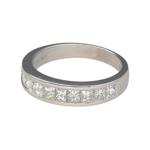 Preowned Platinum & Diamond Set Band Ring in size M with the weight 5.40 grams. There are ten princess cut diamonds set in the band which is 5mm wide at the front. There is approximately 1ct of diamond content in total at approximate clarity Si2 and colour K - M