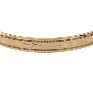 Preowned 9ct Yellow Solid Gold Patterned Bangle with the weight 10.60 grams. The bangle width 6mm and the bangle diameter is 6.7cm