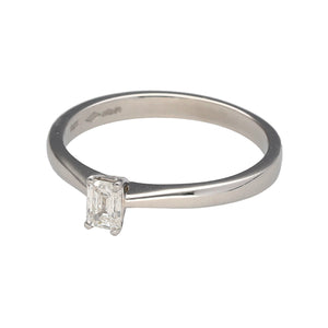 Preowned Platinum & Diamond Emerald Cut Solitaire Ring in size N to O with the weight 3.60 grams. The diamond is approximately 25pt with approximate clarity Si1 and colour K - M