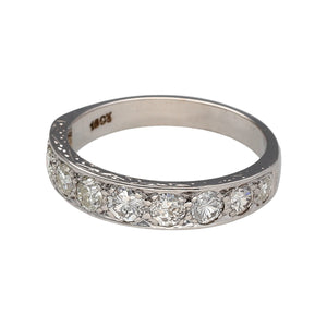 Preowned 18ct White Gold & Diamond Set Band Ring in size N with the weight 3.90 grams. There is approximately 90pt - 1ct of diamond content at approximate clarity Si - i1 and colour K - M. The band is 4mm wide at the front