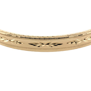 Preowned 9ct Yellow Solid Gold Engraved Patterned Bangle with the weight 11.20 grams. The bangle width is 7mm and the bangle diameter is 6.8cm 