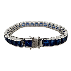 Preowned 925 Silver & Sapphire coloured stone Set 7.5" Bracelet with the weight 33.60 grams. The sapphire coloured stones are each 6mm by 6mm