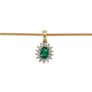 Preowned 9ct Yellow and White Gold Diamond & Emerald Set Cluster Pendant on an 18" curb chain with the weight 3.20 grams. The emerald stone is 6mm by 4mm