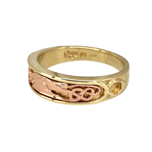 Preowned 9ct Yellow and Rose Gold Clogau Dragon Wing Band Ring in size Y with the weight 9.20 grams. The front of the band is 7mm wide