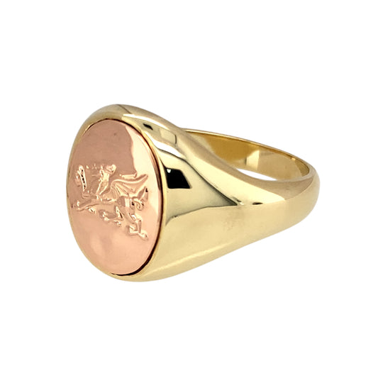 Preowned 9ct Yellow and Rose Gold Clogau Welsh Dragon Oval Signet Ring in size X with the weight 13.10 grams. The front of the ring is 17mm high