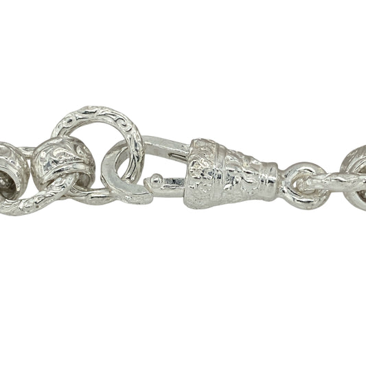 Bring vintage character and bold detail to your jewellery collection with this new 925 silver 8.5" patterned engraved rollerball bracelet—a substantial piece combining timeless design with intricate craftsmanship.
Design: Featuring 10mm wide rollerball-style links, the bracelet alternates between polished and intricately engraved links, creating a classic yet distinctive look.