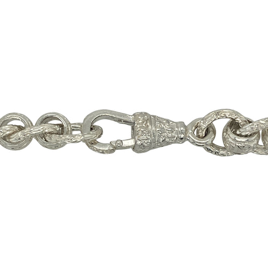 Command attention with this new 925 solid silver rollerball chain, a heavyweight design with bold patterned links—perfect for standout style and statement wear.
Design: The chain features large rollerball-style links, each measuring 11mm in width, with a patterned finish that adds texture and detail.
Material: Made from solid 925 sterling silver, the polished surface ensures durability and lasting shine.