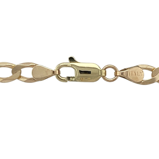 Add bold sophistication and timeless appeal to your collection with this pre-owned 9ct yellow gold curb chain, a classic piece offering both substance and shine—perfect for everyday wear or special occasions.
Design: The chain features traditional flat curb links measuring 5mm wide, creating a sleek, polished look that reflects light beautifully and lies smoothly against the neckline.