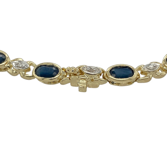 Bring timeless colour and refined sparkle to your jewellery collection with this pre-owned 9ct yellow gold diamond & sapphire set bracelet, offering classic elegance with a luxurious feel.
Design: The bracelet features a graceful line design, showcasing oval sapphires evenly spaced and accented with diamonds to create a balanced and sophisticated look.