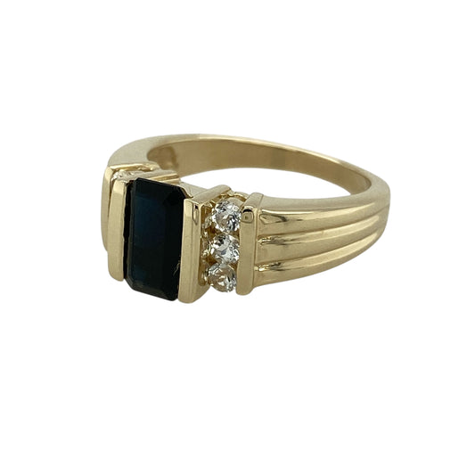 Bring rich colour and refined sparkle to your jewellery collection with this pre-owned 9ct yellow gold indicolite and white topaz set ring.
Design: The ring features a rectangular indicolite stone at the centre, measuring approximately 8mm by 5mm, forming a striking focal point, with white topaz stones accenting the design for added brilliance.