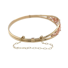 Load image into Gallery viewer, Preowned 9ct Yellow and Rose Gold Clogau Tree of Life Bangle with a safety chain with the weight 10.70 grams. The front of the ring is 11mm high and the bangle diameter is 6cm
