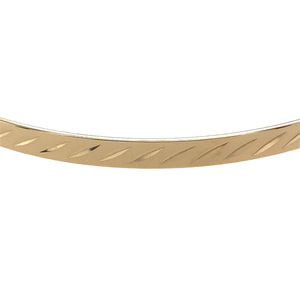 Preowned 9ct Yellow Solid Gold Patterned Bangle with the weight 6 grams. The bangle width is 4mm and the bangle diameter is 6.8cm 