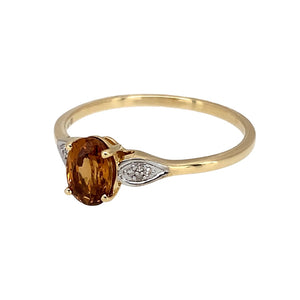 Preowned 10ct Yellow and White Gold Diamond & Citrine coloured stone Set Ring in size S with the weight 1.80 grams. The citrine coloured stone is 7mm by 5mm