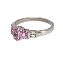 Load image into Gallery viewer, Preowned 9ct White Gold Diamond &amp; Pink Sapphire Set Ring in size N with the weight 2.30 grams. The ring is made up with three oval cut pink sapphire stones are two baguette cut diamonds on either side. The center sapphire stone is 6mm by 4mm and the side stones are each 4mm by 3mm
