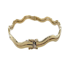 Load image into Gallery viewer, Preowned 9ct Yellow Gold Wavey Hinged Bangle with the weight 12.40 grams. The bangle width is 6mm and the bangle diameter is 6.5cm
