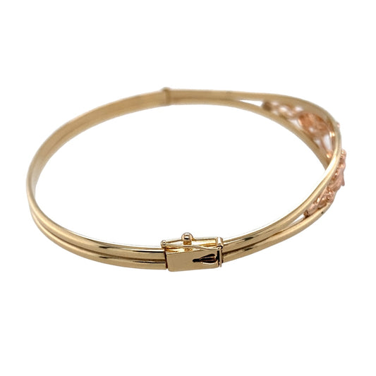 Preowned 9ct Yellow and Rose Gold Clogau Tree of Life Bangle with the weight 11.60 grams. The front of the bangle is 11mm high and the diameter of the bangle is 6.5cm 