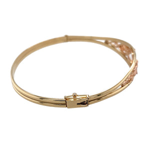 Preowned 9ct Yellow and Rose Gold Clogau Tree of Life Bangle with the weight 11.60 grams. The front of the bangle is 11mm high and the diameter of the bangle is 6.5cm&nbsp;