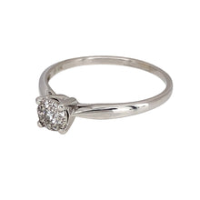 Load image into Gallery viewer, Preowned 9ct White Gold &amp; Diamond Illusion Set Solitaire Ring in size S with the weight 1.90 grams. There is approximately 13pt of diamond content with approximate clarity i1 and colour J - K
