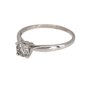 Preowned 9ct White Gold & Diamond Illusion Set Solitaire Ring in size S with the weight 1.90 grams. There is approximately 13pt of diamond content with approximate clarity i1 and colour J - K