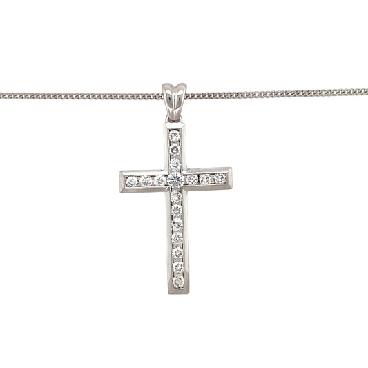 Preowned 18ct White Gold & Diamond Set Cross Pendant on an 18" curb chain with the weight 9 grams. The pendant is 3.9cm long including the bail and the pendant contains approximately 75pt of diamond content. The diamonds are approximate clarity Si - i and colour H - J
