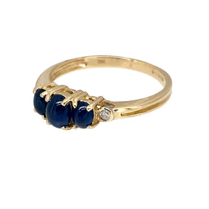 Preowned 9ct Yellow Gold Diamond & Blue Stone Cabochon Set Ring in size N with the weight 2 grams. The center stone is 5mm by 4mm