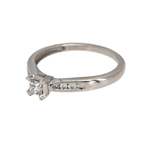 Preowned 9ct White Gold & Diamond Set Solitaire Ring with diamond set shoulders. The ring is in size P with the weight 2.10 grams. The diamond is approximately 25pt with approximate clarity i1 and colour J - K