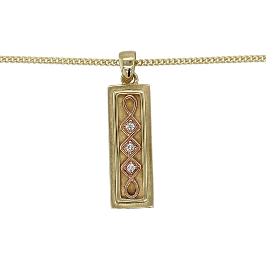 Celebrate heritage and luxury with this pre-owned 9ct yellow and rose gold diamond set Celtic Clogau ingot pendant—rich in symbolism, beautifully detailed, and crafted as a limited edition piece.
Design: This striking 3.2cm long pendant features a classic ingot shape adorned with an intricate Celtic design in warm rose gold, accented by approximately 6 points of sparkling diamonds for added brilliance.