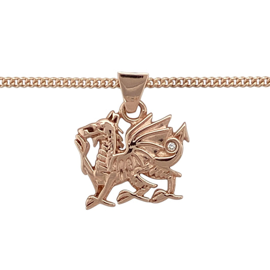 Bring national pride and fiery elegance to your collection with this pre-owned 9ct rose gold Clogau Welsh Dragon pendant necklace, accented with a diamond for added sparkleβperfect for showcasing heritage with bold style.
Design: The pendant measures 2cm long including the bail and features the iconic Welsh Dragon, symbolising strength and tradition. A single diamond adds a subtle touch of brilliance to this powerful emblem. It hangs from an 18" Clogau rose gold curb chain for a cohesive and polished look.