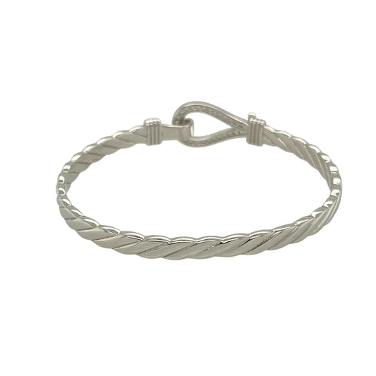 Bring playful sparkle and classic charm to a young jewellery collection with this new solid 925 silver and cubic zirconia children's horseshoe bangle—a sweet and symbolic piece designed with timeless appeal.
Design: The 11mm high front features a horseshoe motif adorned with shimmering cubic zirconia stones, symbolising luck and adding a touch of sparkle.
Material: Made from solid 925 sterling silver, the polished finish offers a bright, smooth shine that enhances the brilliance of the stones.