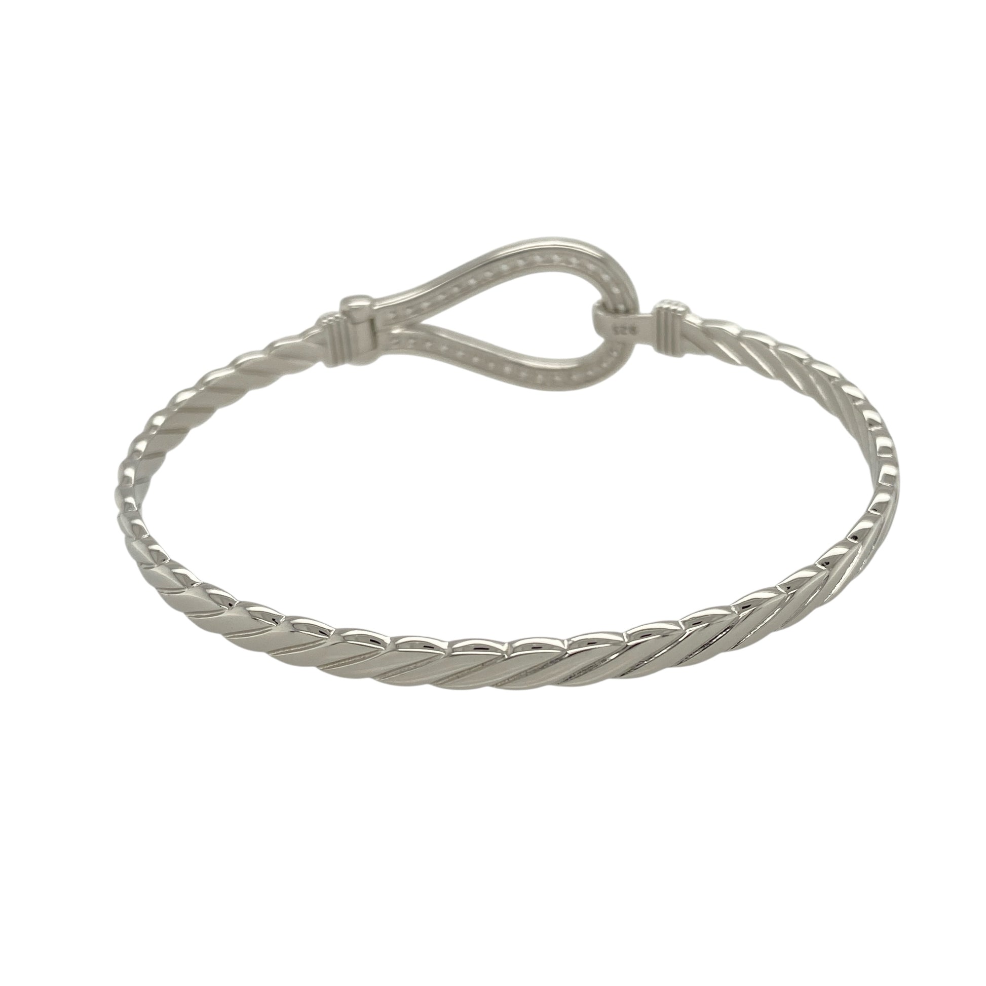 Bring classic symbolism and refined sparkle to your jewellery collection with this new solid 925 silver and cubic zirconia horseshoe bangle—a striking piece that combines timeless design with a touch of luck and brilliance.
Design: The 17mm high front features a bold horseshoe motif set with cubic zirconia stones, offering a radiant symbol of good fortune and graceful style.