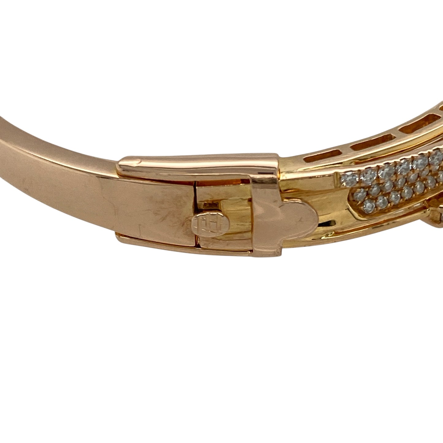 Add luxurious sparkle and modern elegance to your collection with this pre-owned 18ct rose gold and diamond set crossover bangle—a stunning piece that combines graceful movement with radiant brilliance, perfect for special occasions or as a show-stopping everyday statement.
Design: This bangle features an intricate crossover design with three rows of diamonds at the centre, a diamond set crossover row, and larger diamond accents scattered above and below for added dimension and eye-catching detail.