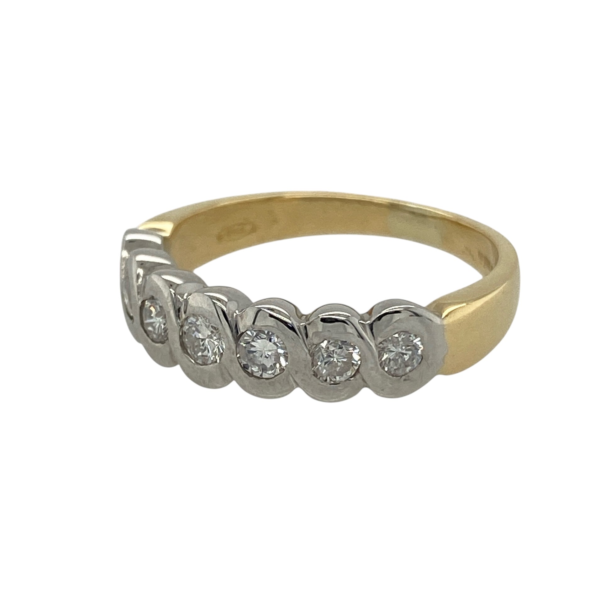 Bring luxurious sparkle and timeless elegance to your collection with this pre-owned 18ct yellow gold and diamond seven stone band ring, offering a refined design and striking presence—perfect for making a sophisticated statement.
Design: The ring features a beautifully crafted woven white gold setting that holds seven shimmering diamonds, with approximately 0.42ct of total diamond content. The intricate design and bright white gold contrast create an eye-catching and elegant focal point.